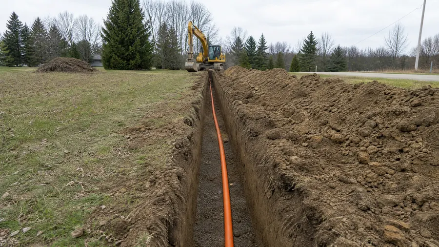 Trench with utility line laid in
