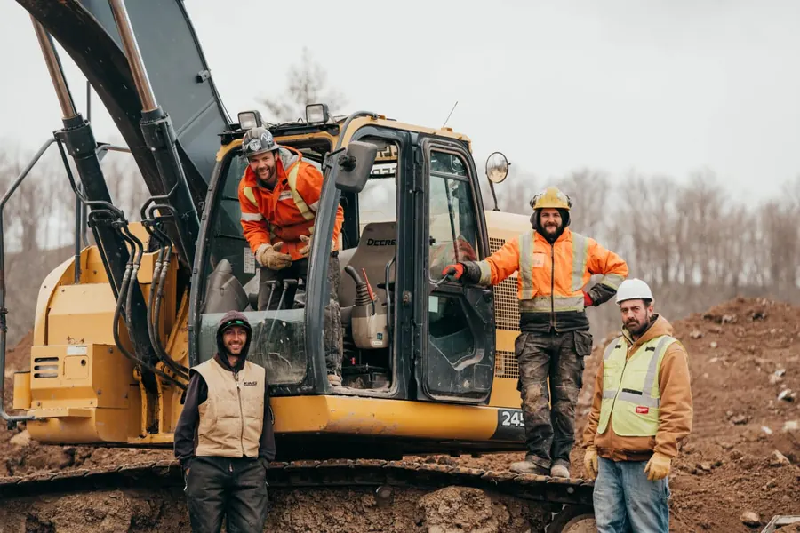 The MXC Excavating crew with their excavator