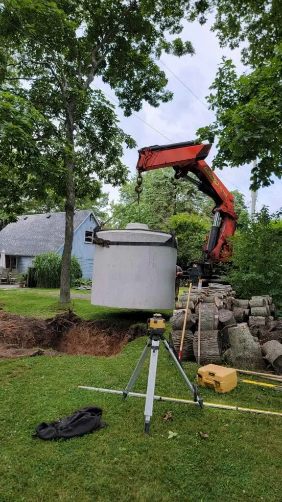 Holding tank excavation with survey equipment
